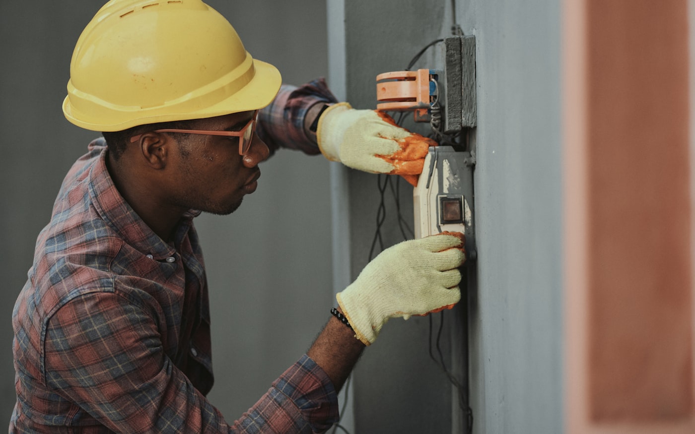 An electrician installing wiring