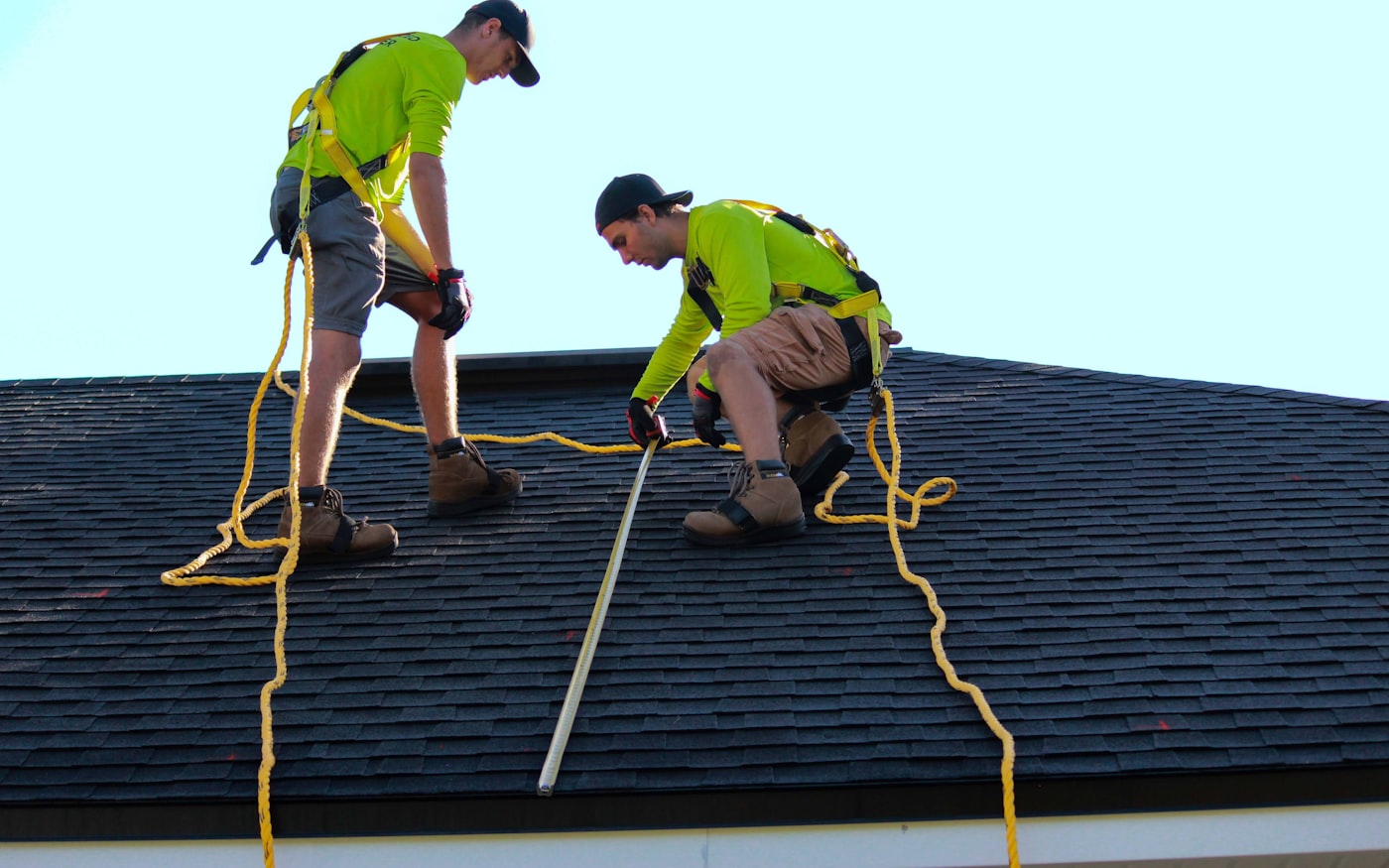 Roofers working on a residential roof